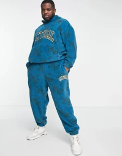 Tall*DESIGN Actual Co-Ord Relaxed Polar Fleece Joggers With All Over Print And Applique Logo In Blue